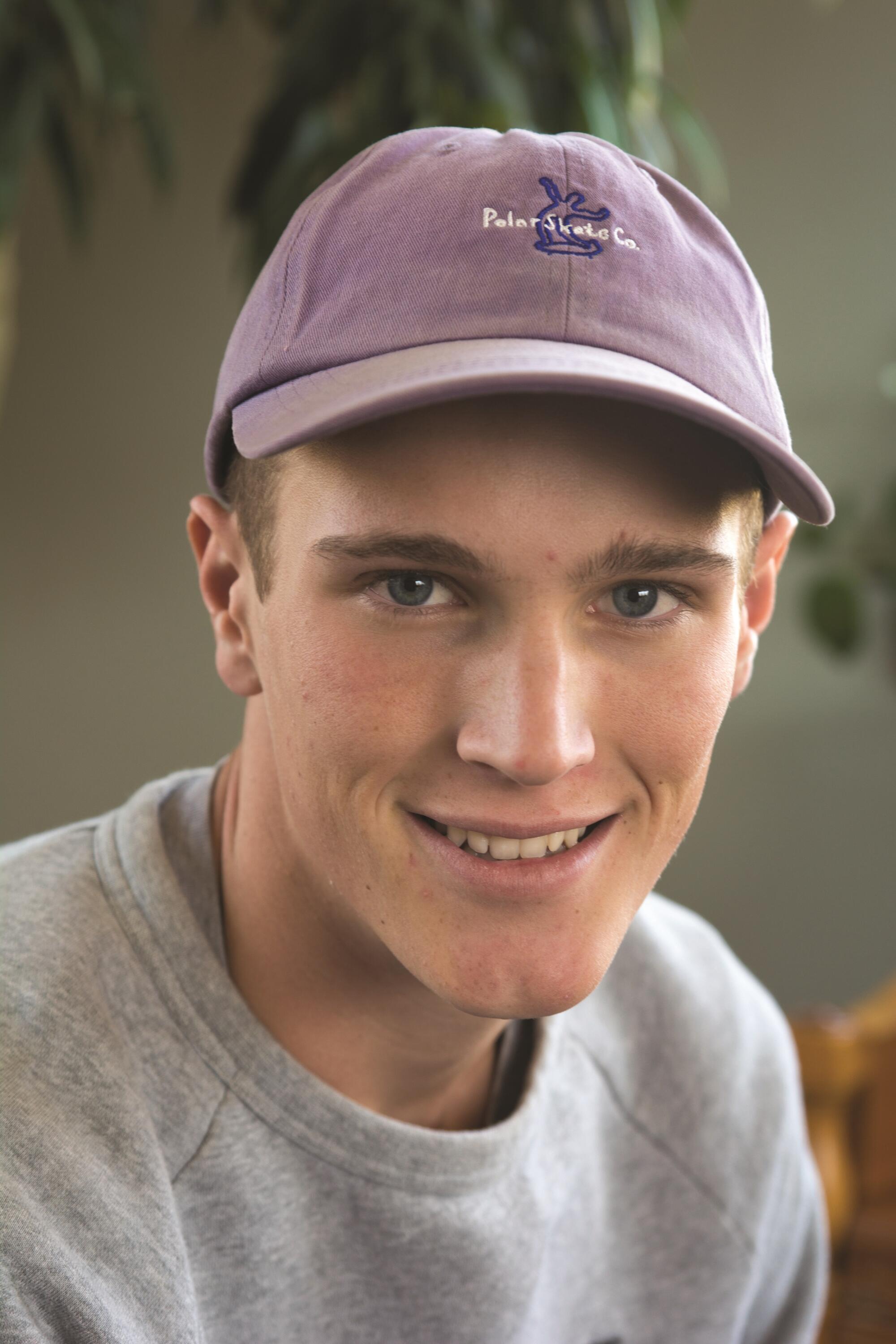 A teenage boy smiling