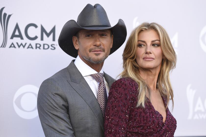 Tim McGraw, left, and Faith Hill arrive at the 52nd annual Academy of Country Music Awards at the T-Mobile Arena on Sunday, April 2, 2017, in Las Vegas. (Photo by Jordan Strauss/Invision/AP)
