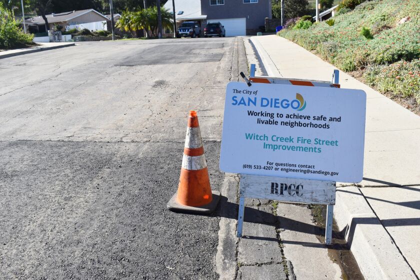 A sign on Nevoso Way in Rancho Bernardo indicates its repairs are part of the Witch Creek Fire Street Improvements project.
