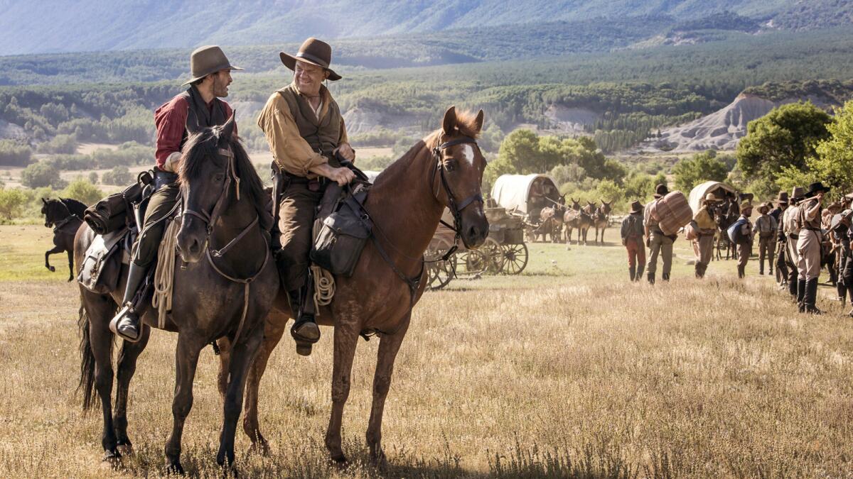 Joaquin Phoenix, left, and, John C. Reilly in the movie "The Sisters Brothers."