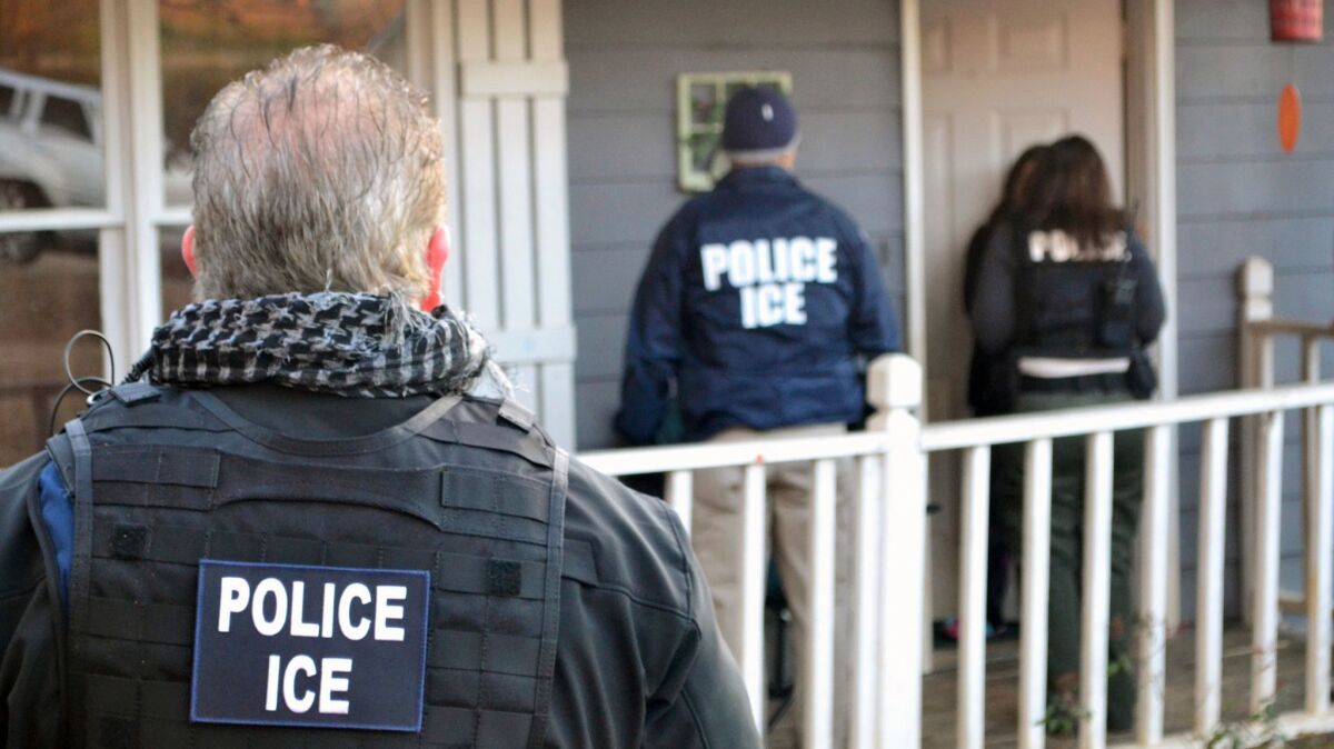 ICE agents arrive at a home in Atlanta during a targeted enforcement operation aimed at immigration fugitives, re-entrants and at-large criminal immigrants on Feb. 9.