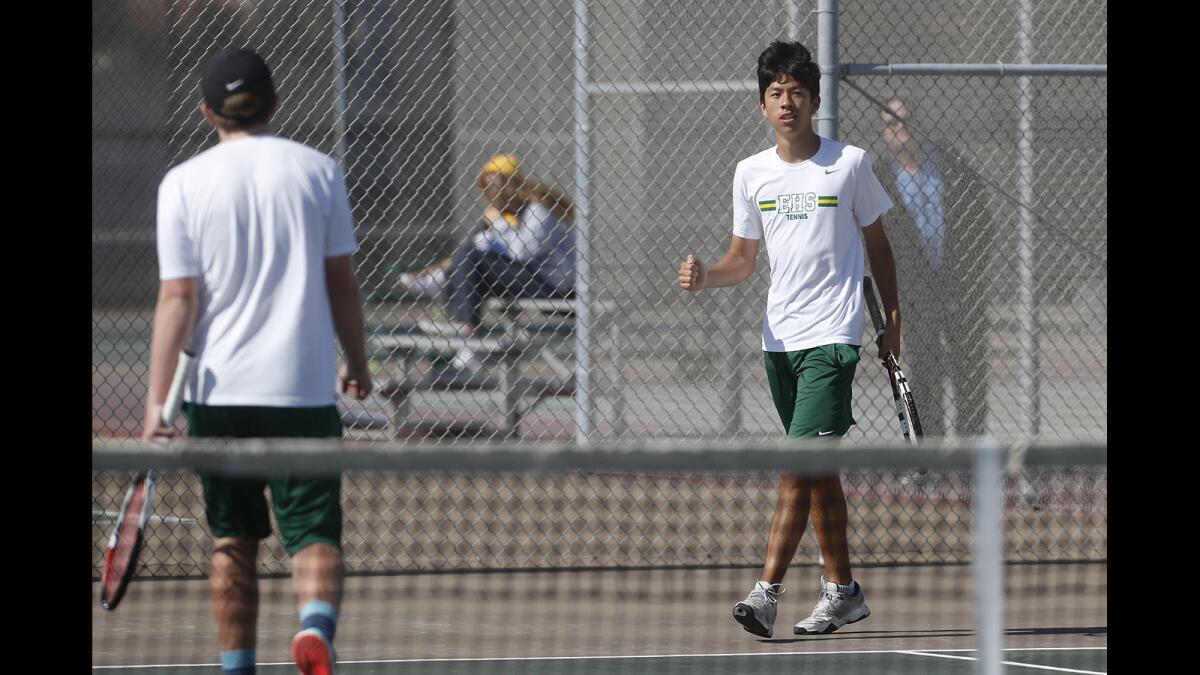 Edison High No. 1 doubles player Ryan Lum, right, celebrates a point with teammate Logan Sherouse against Walnut in the quarterfinals of the CIF Southern Section Division 2 playoffs at home on Monday.