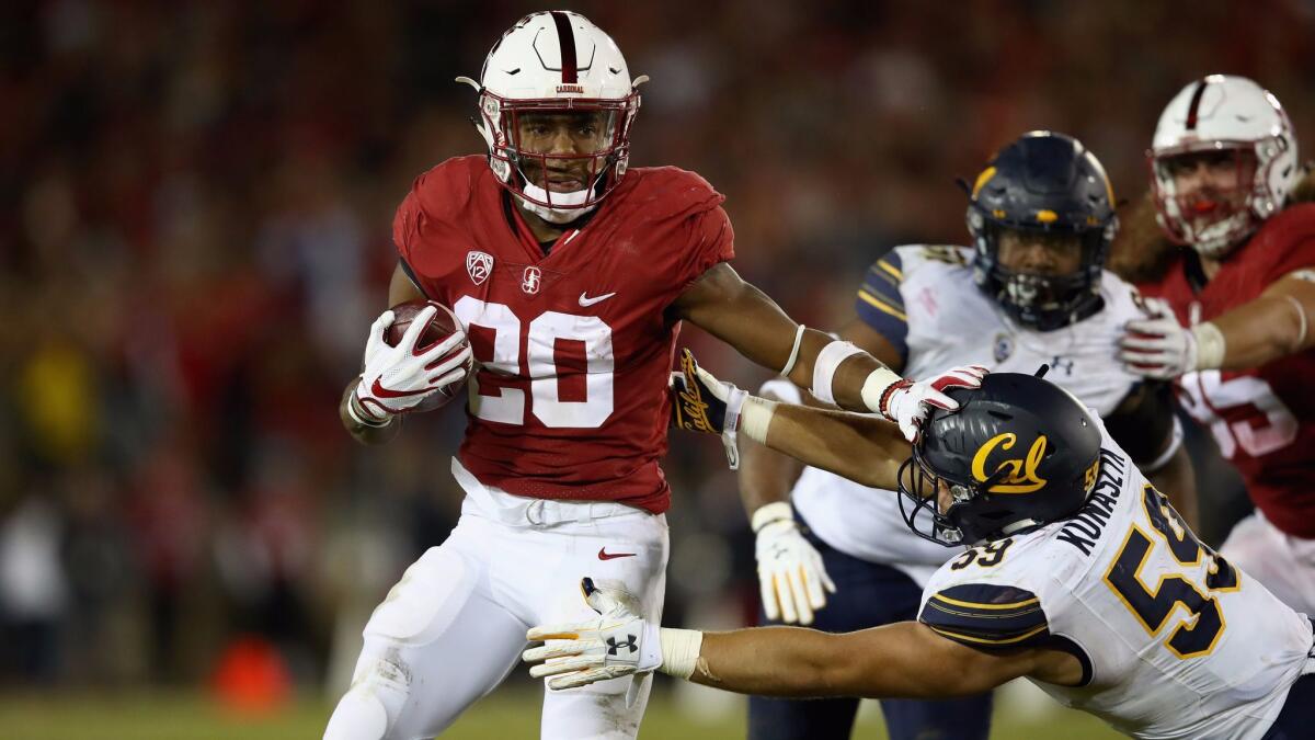 Bryce Love runs with the ball against the California Golden Bears at Stanford Stadium.