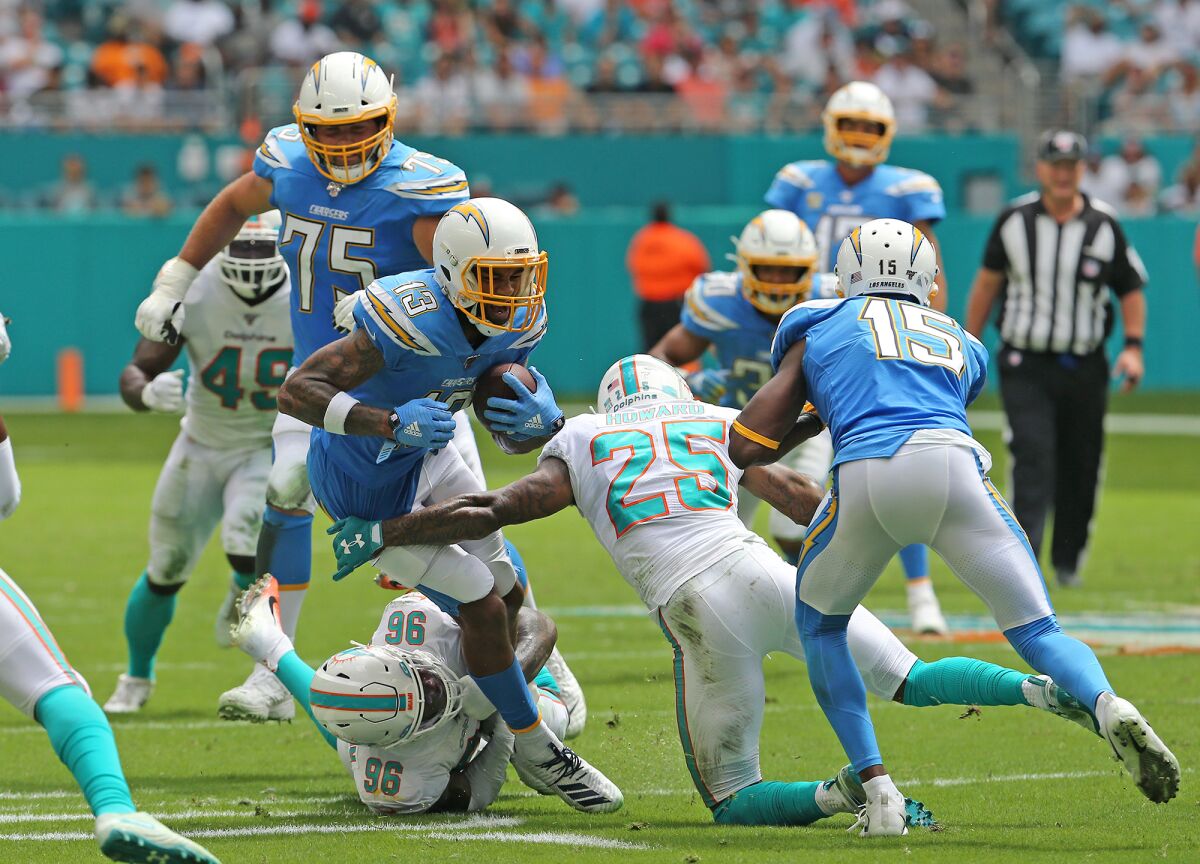Chargers wide receiver Keenan Allen is tackled against the Dolphins.