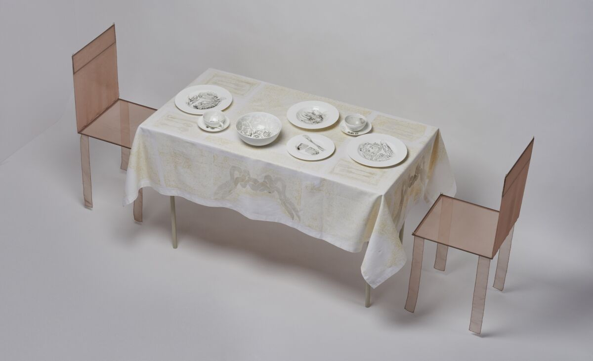 "Dinner for Two in One Month of Smog, 2011" consists of white porcelain dinnerware and linens colored by air pollution.