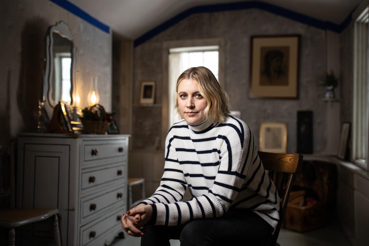Director Greta Gerwig inside Abigail May Alcott's room, where her drawings still reside on the walls.