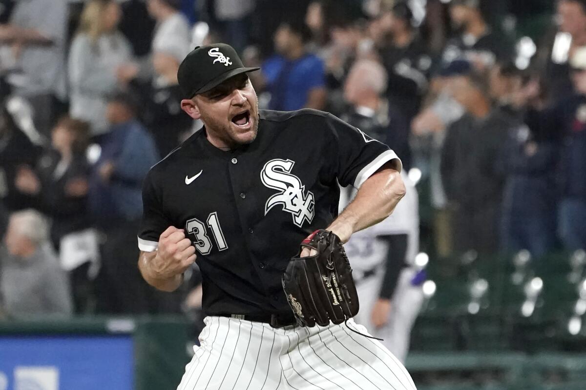Chicago White Sox relief pitcher Liam Hendriks celebrates the team's 4-2 win over the Colorado Rockies in a baseball game Tuesday, Sept. 13, 2022, in Chicago. (AP Photo/Charles Rex Arbogast)