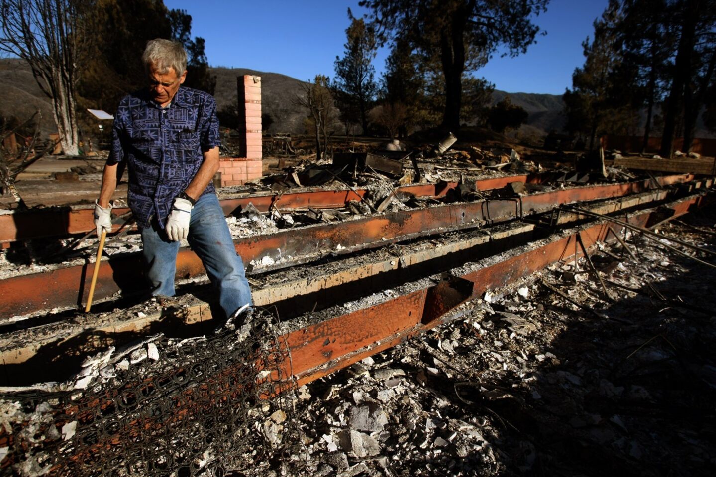 Joe Biviano, 63, returned to find his home burned to the ground by the Powerhouse fire on Sylvan Drive in Lake Hughes on Monday. "We lived here for 15 years, but lost 40 years of memories," Biviano said. "This is just stuff. But it still hurts when you don't have your stuff."