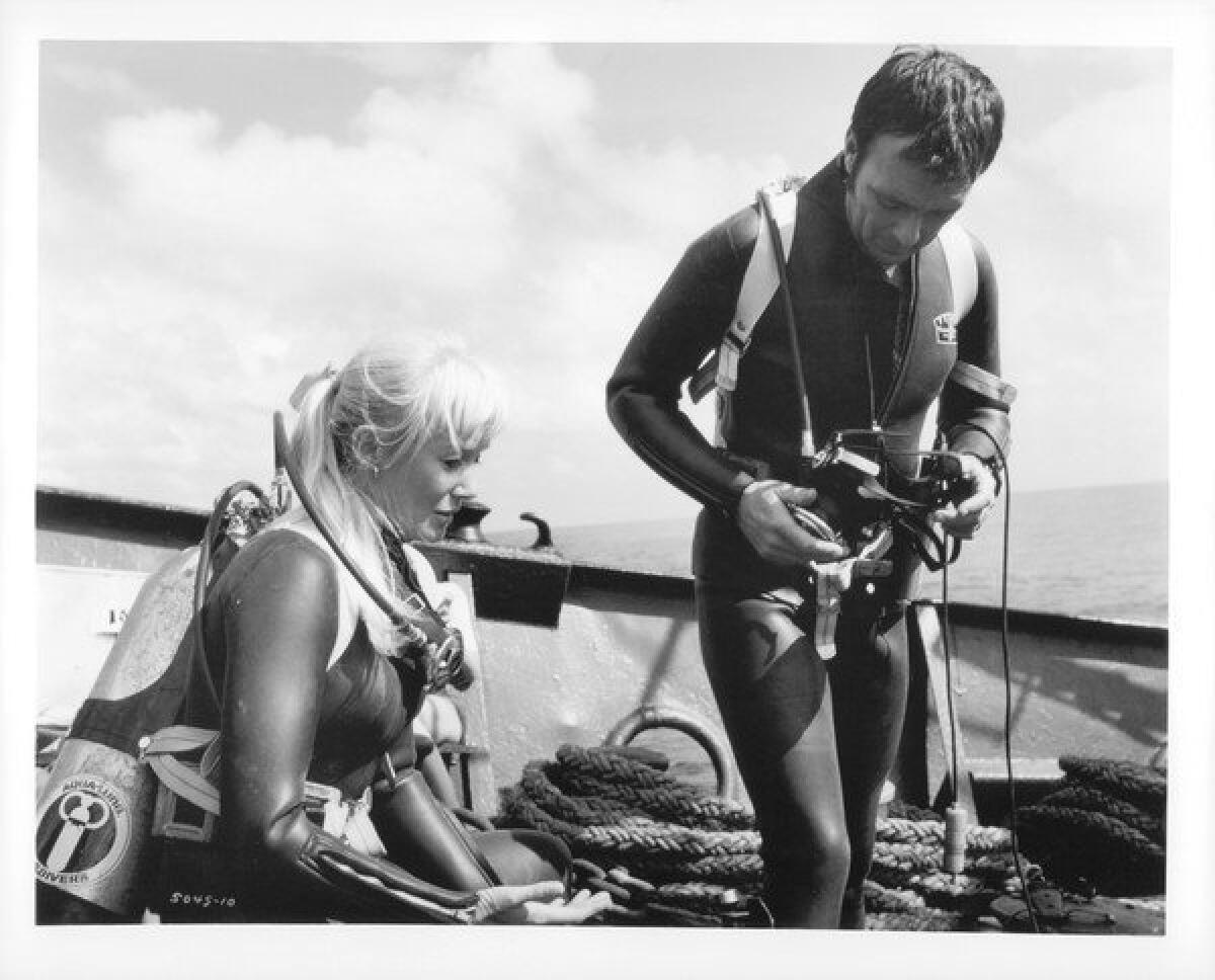 Valerie Taylor and Ron Taylor in "Blue Water, White Death." Ron Taylor filmed a shark tearing an underwater cage apart for "Jaws."