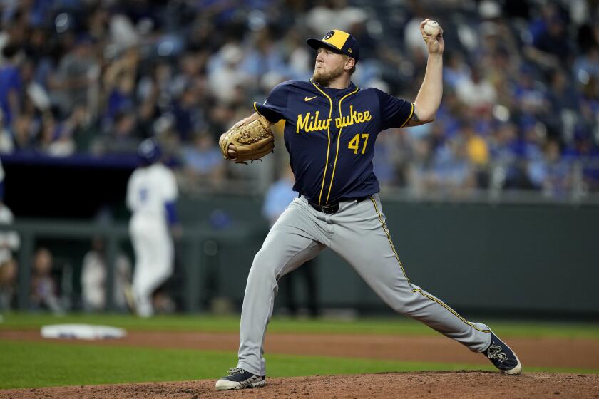 Milwaukee Brewers pitcher Jared Koenig throws during the seventh inning of a baseball game against the Kansas City Royals Tuesday, May 7, 2024, in Kansas City, Mo. (AP Photo/Charlie Riedel)