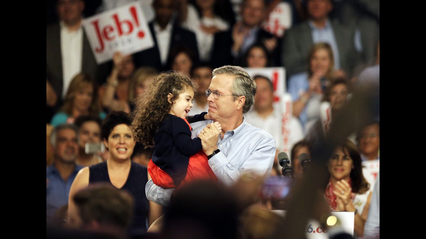 Bush dances with his granddaughter after his announcement.