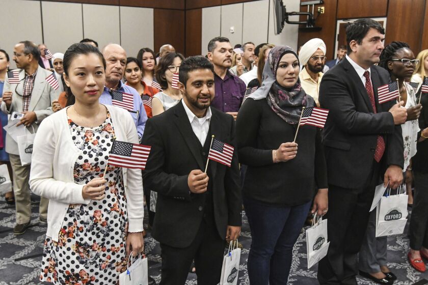 Fifty people from more than 20 countries took the oath of citizenship in Oxford, Miss.