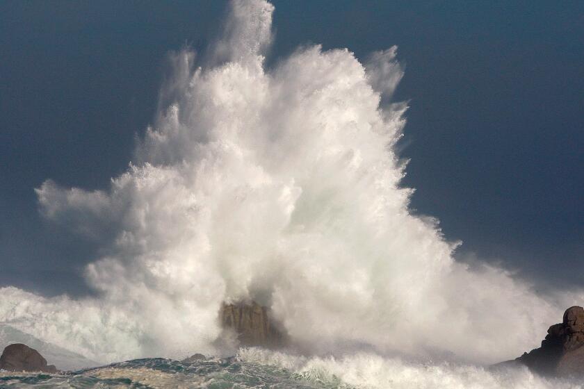 Large waves break off the shoreline Wednesday, Nov. 9, 2016, in Pacific Grove, Calif. A weather front from the Gulf of Alaska was sending sets of 20-foot-high waves to beaches ranging from Point Reyes southward to Big Sur on the California coast. (Vern Fisher/Monterey Herald via AP)