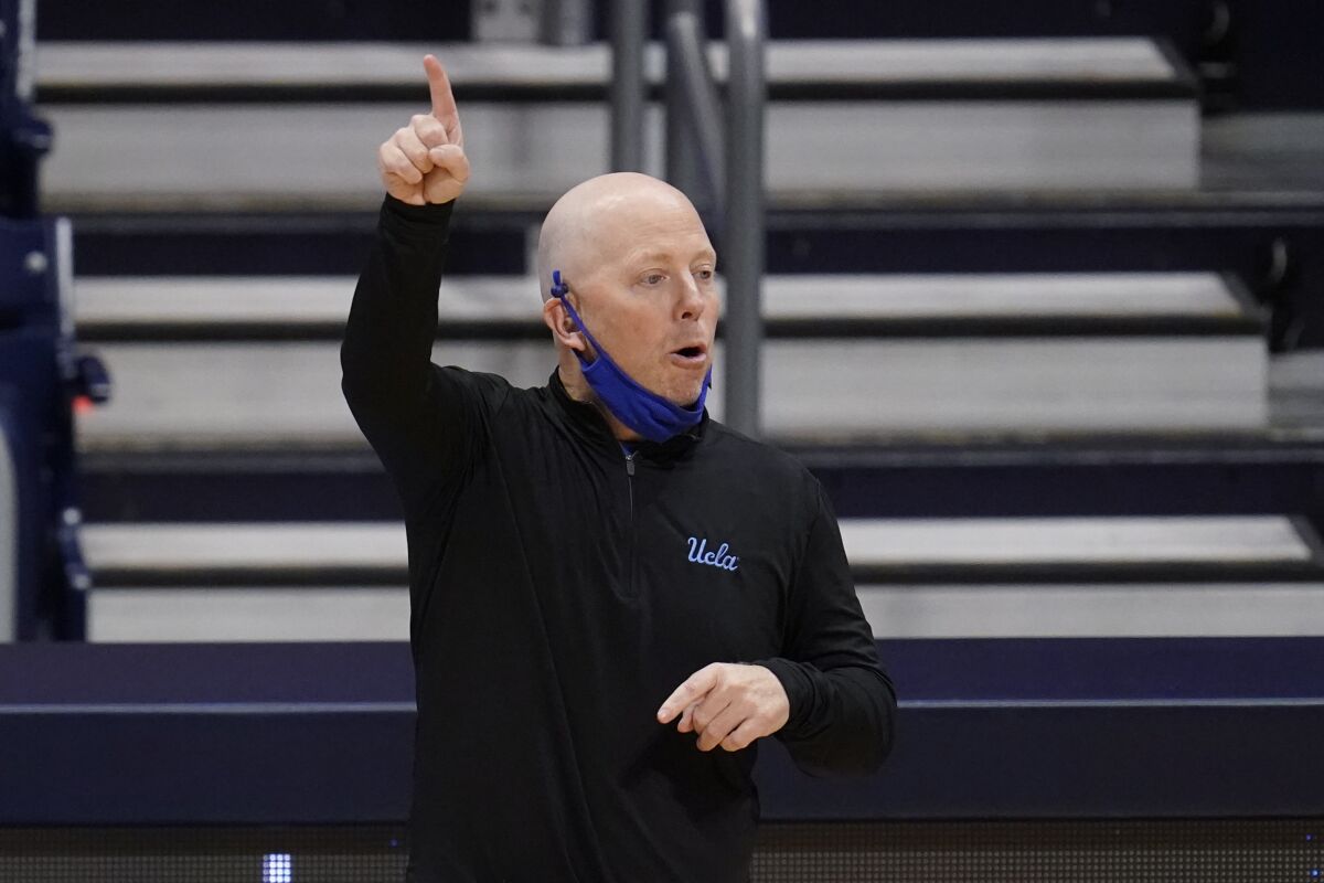 UCLA coach Mick Cronin gestures during a Sweet 16 game against Alabama.