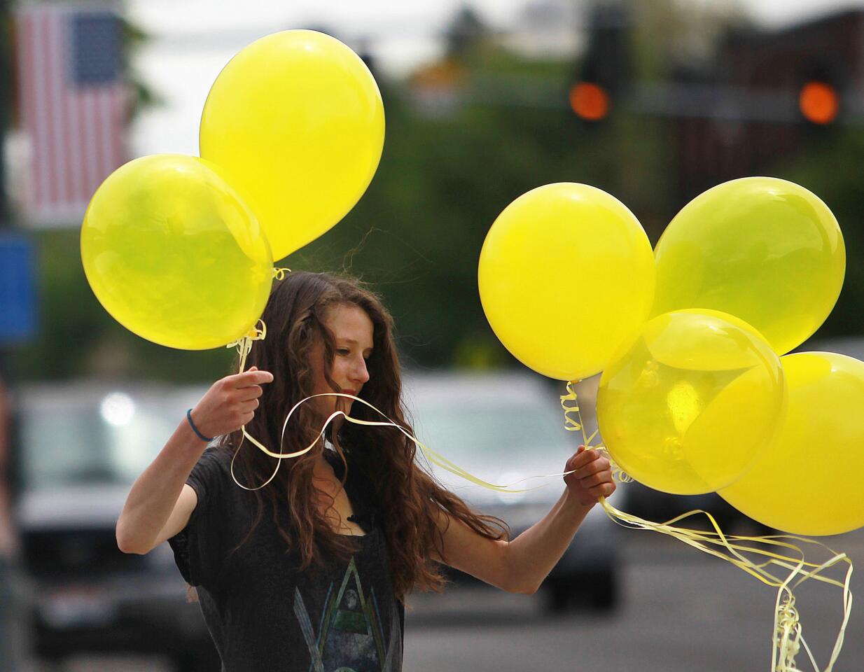 Rachel Malone, 17, ties balloons along Main Street in Hailey, Idaho after the announcement that U.S. Army Sgt. Bowe Bergdahl had been released from captivity.