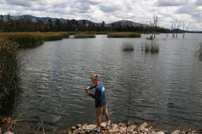 SAN DIEGO, CA-MAY 6, 2016: | Derrick Dykes, 21, of Santee fishes for bass at Otay Lakes in Chula Vista Friday as the skies begin to clear up. Light showers are expected to continue through Saturday. | (Misael Virgen / San Diego Union-Tribune)