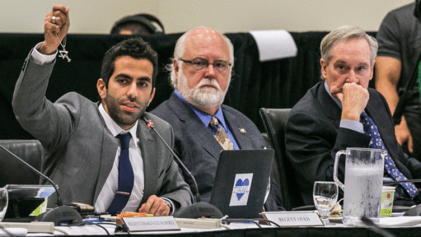 UC's student regent Abraham Oved holds up a Star of David as he addresses the Board of Regents at a meeting to discuss a policy statement on intolerance in 2015.