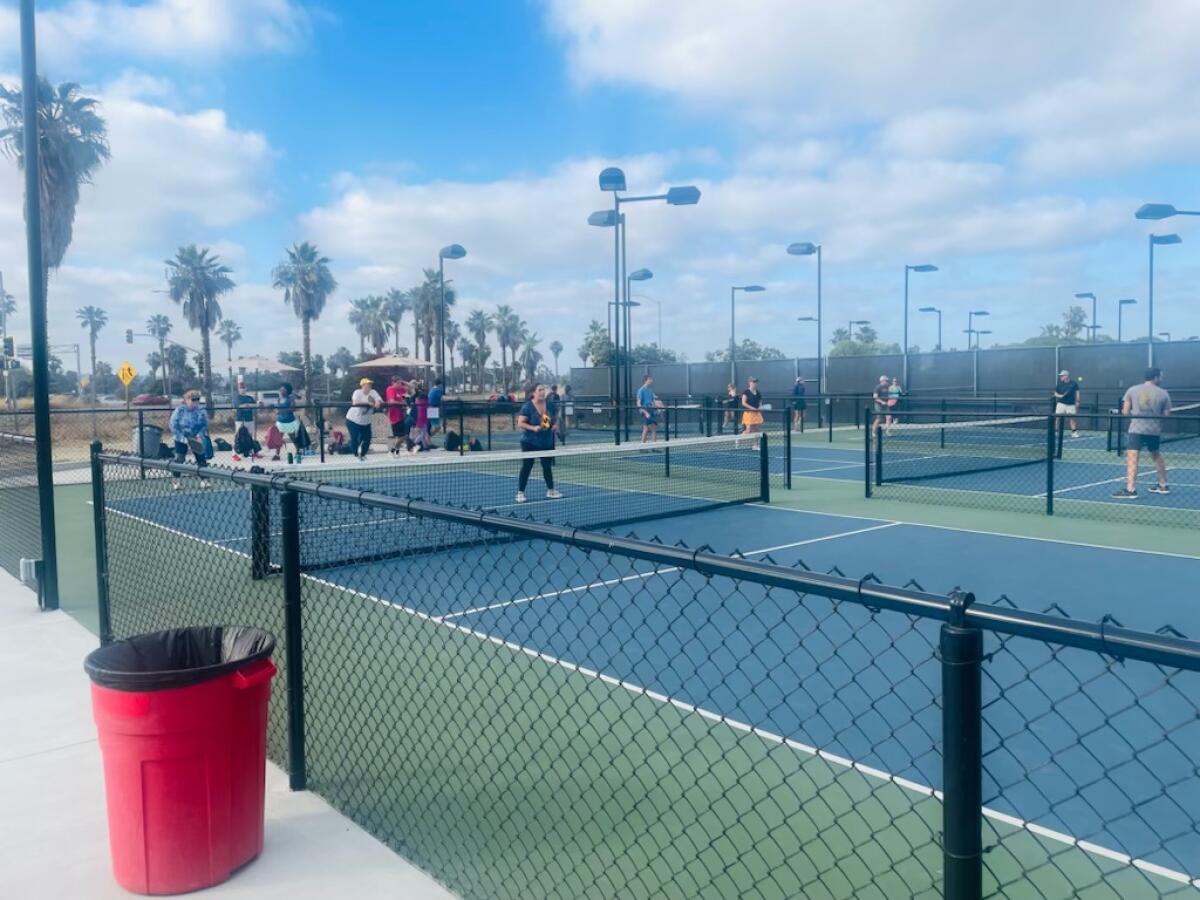 Players try out some of the new pickleball courts at Barnes Tennis Center in Point Loma in July.