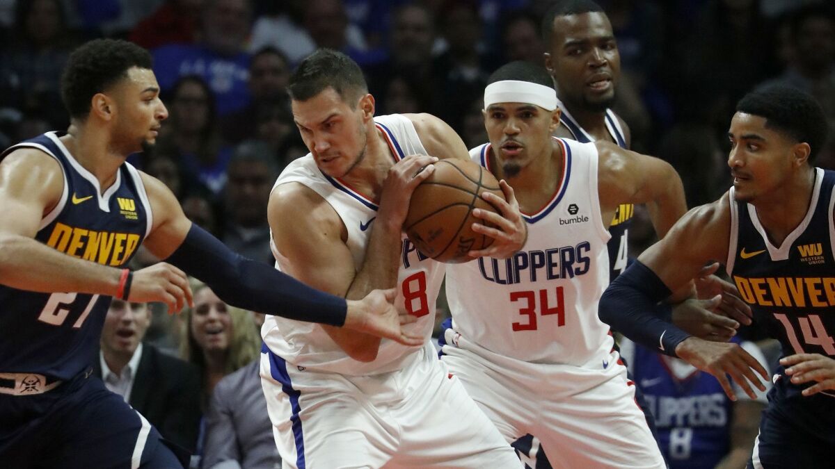 Clippers forward Danilo Galinari pulls down a rebound against the Nuggets in the second quarter.