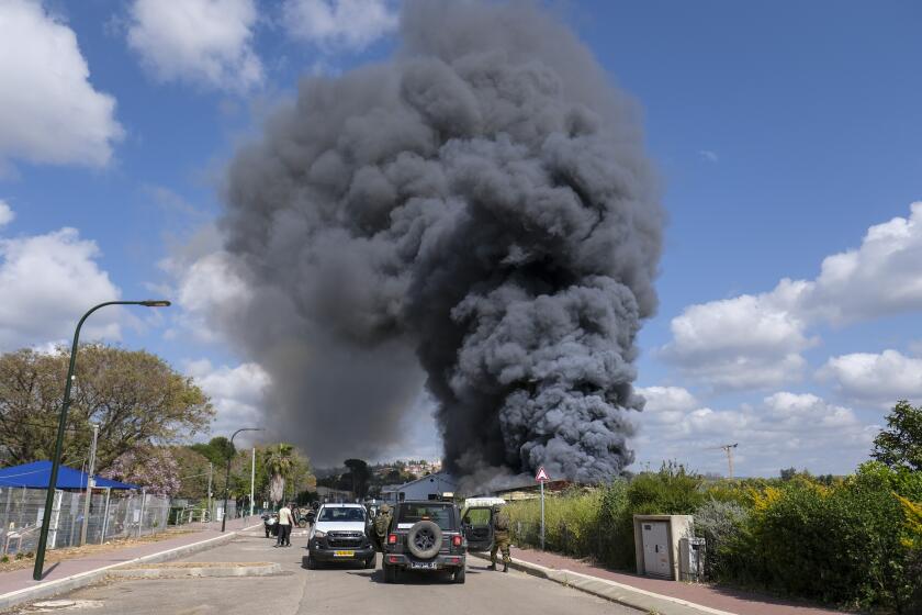 Smoke rises from a fire after rockets fired from Lebanon struck Bezet, northern Israel, Thursday, April 6, 2023. Militants in Lebanon have fired a heavy barrage of rockets at Israel, the Israeli military said, forcing people across Israel's northern frontier into bomb shelters, wounding at least two people and ratcheting up regional tensions a day after Israeli police raided Jerusalem's most sensitive holy site. (AP Photo/Fadi Amun)