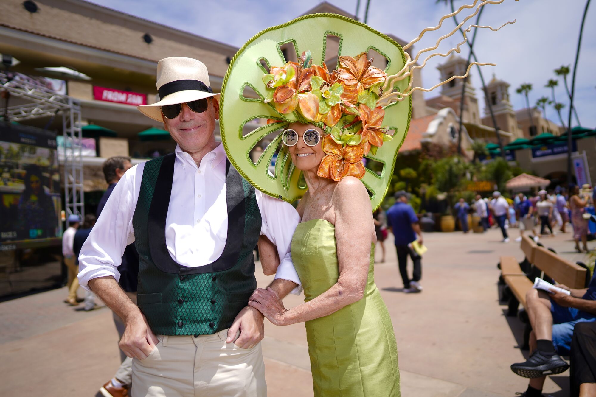 Life partners Thomas Barrett and Belinda Berry were among the race fans taking part in the tradition of wearing hats.