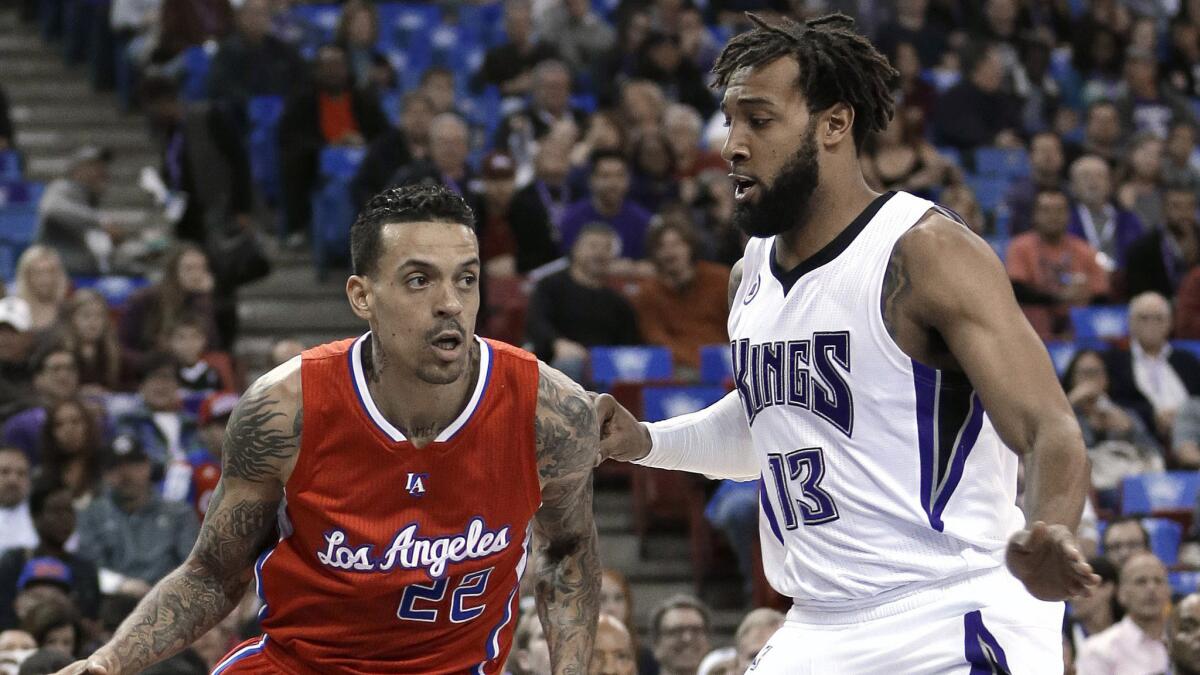 Clippers small forward Matt Barnes, left, tries to drive past Sacramento Kings forward Derrick Williams during a game on Jan. 17.