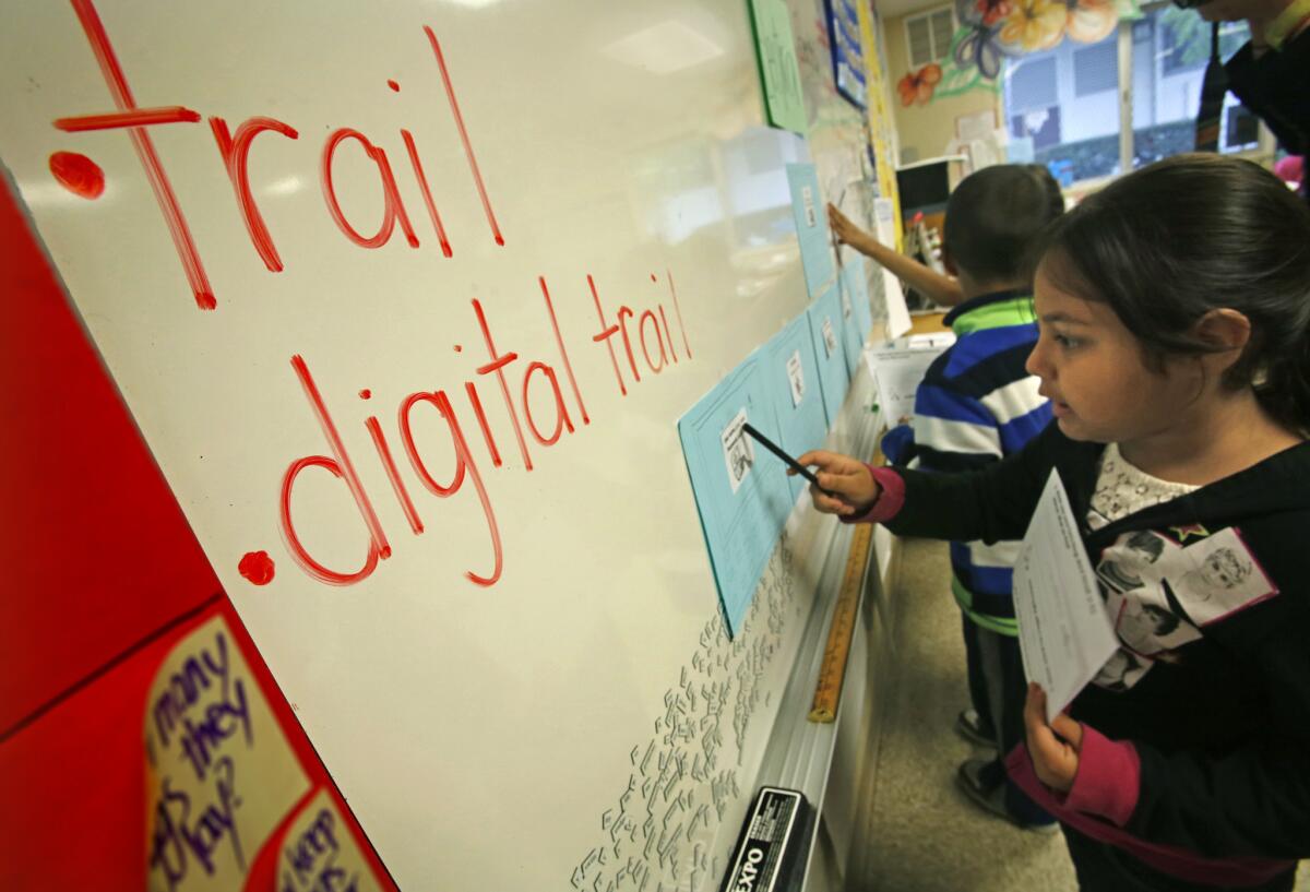 Yvette Fuentes, 7, and her San Pascual Avenue Elementary classmates learn about the dangers of the "digital trail."