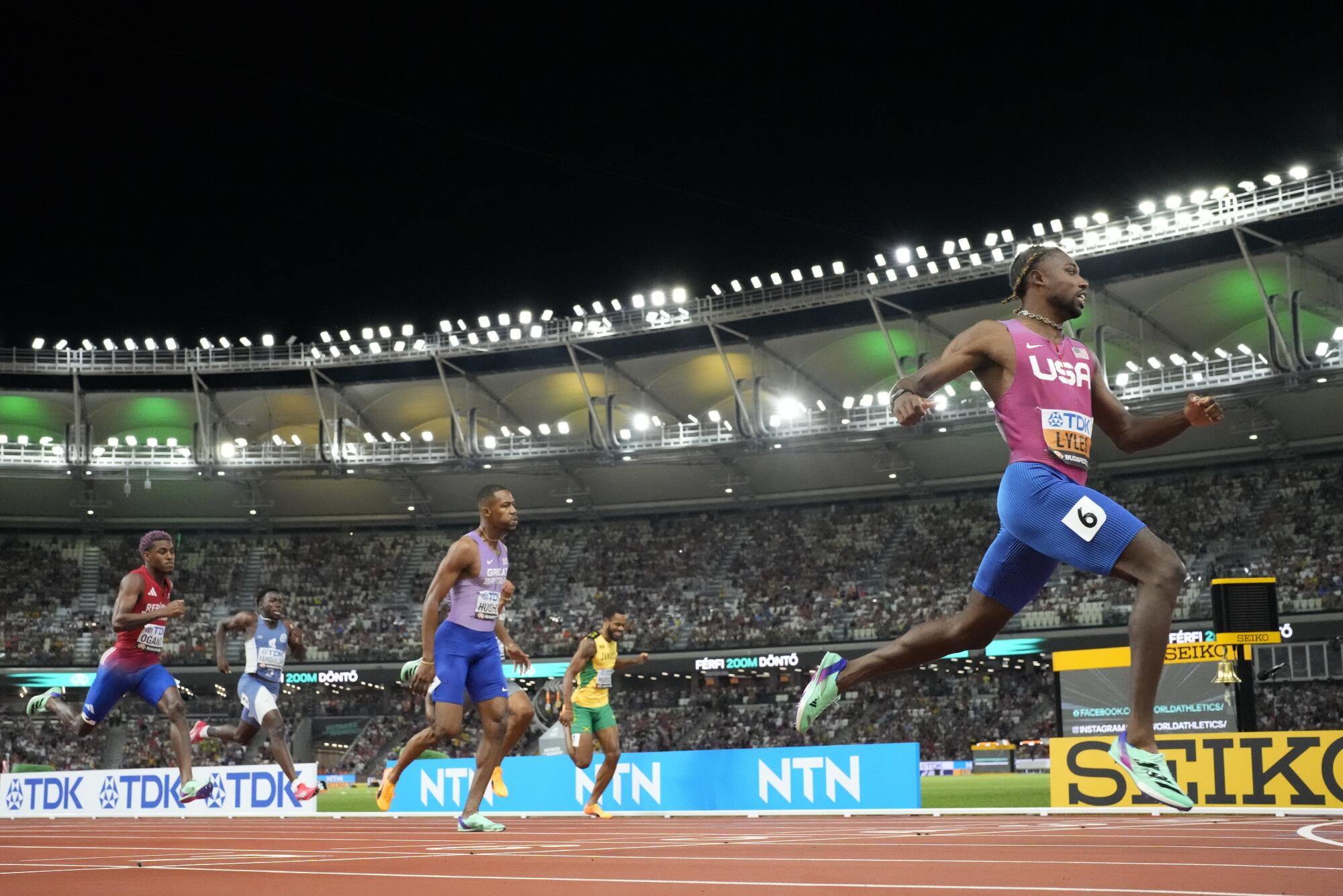 Noah Lyles crosses the finish line to win the men's 200 meters at the World Athletics Championships on Aug. 25.