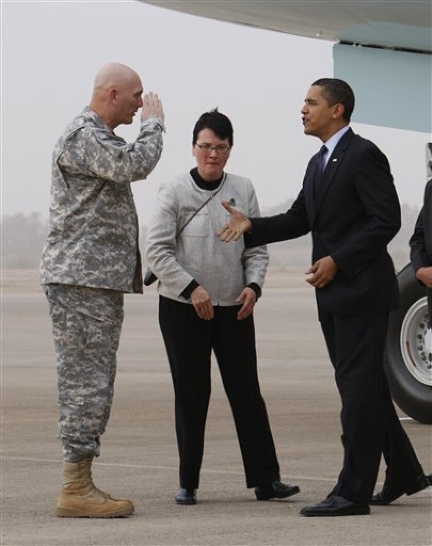 President Barack Obama is greeted by Gen. Ray Odierno, the top U.S. commander in Iraq, as he arrives in Baghdad, Tuesday, April 7, 2009. At center is U.S. Charge d Affaires Patricia Butenis. (AP Photo/Charles Dharapak)