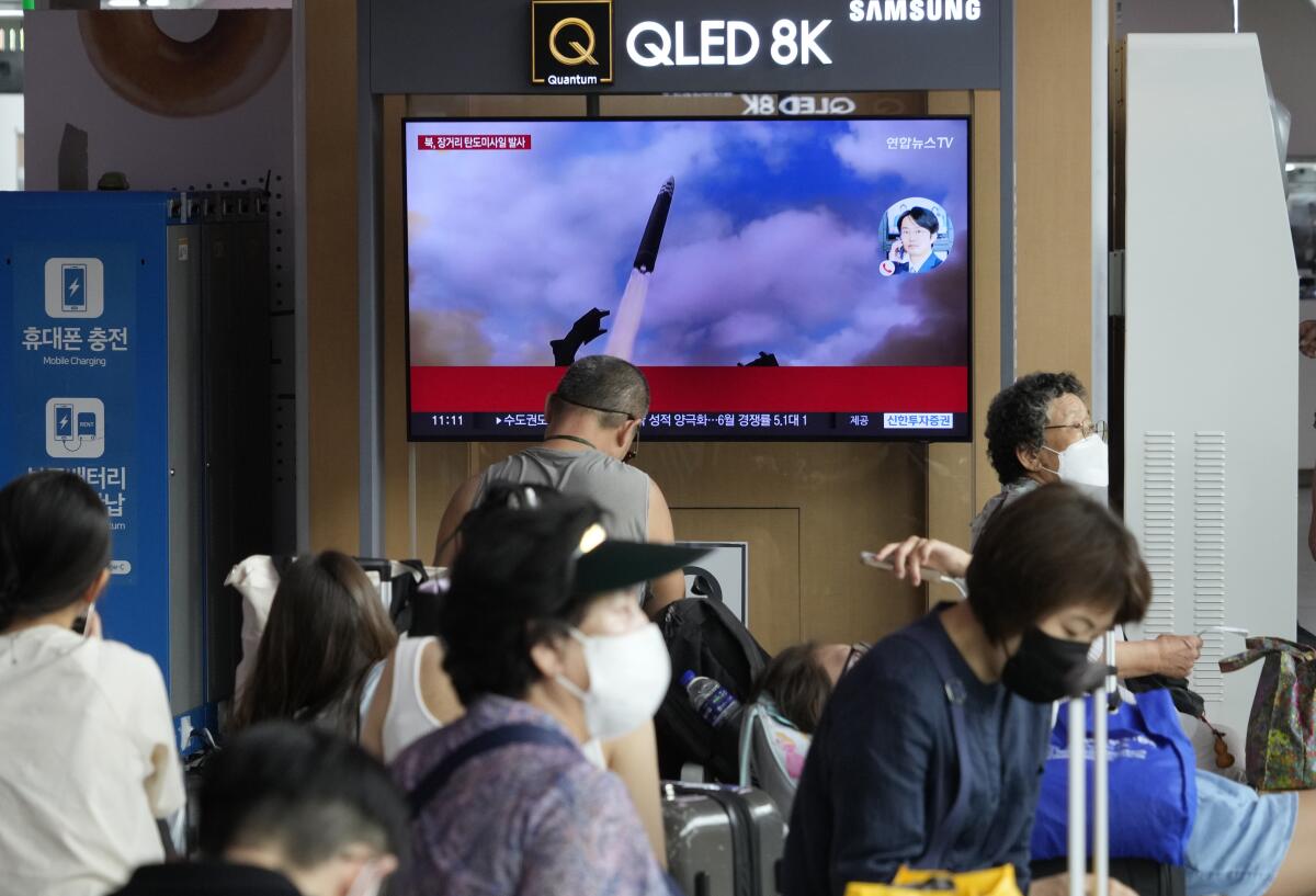 A TV screen showing an image of North Korea's missile launch