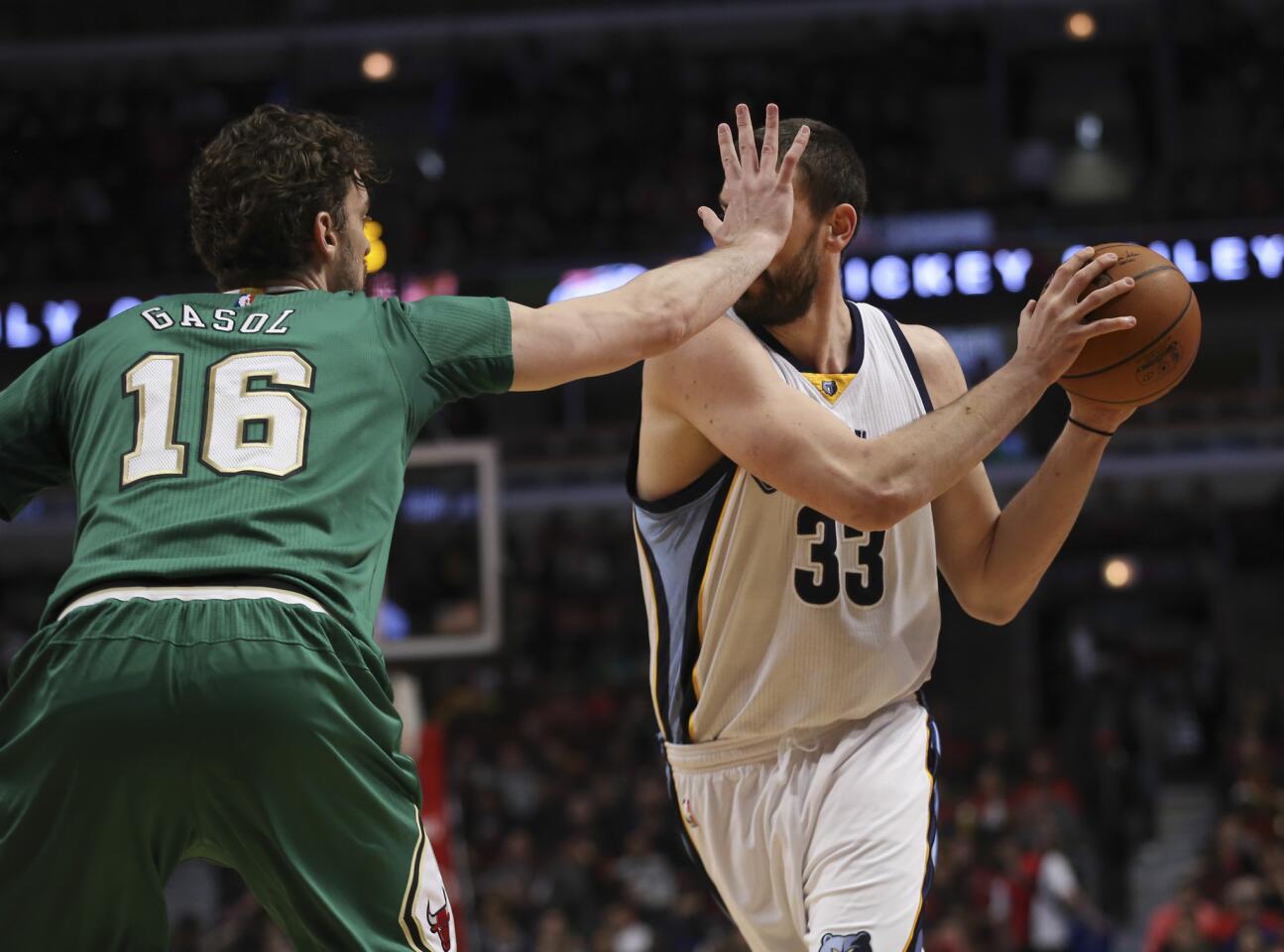 Pau Gasol tries to block the view of Grizzlies center Marc Gasol during the second half.