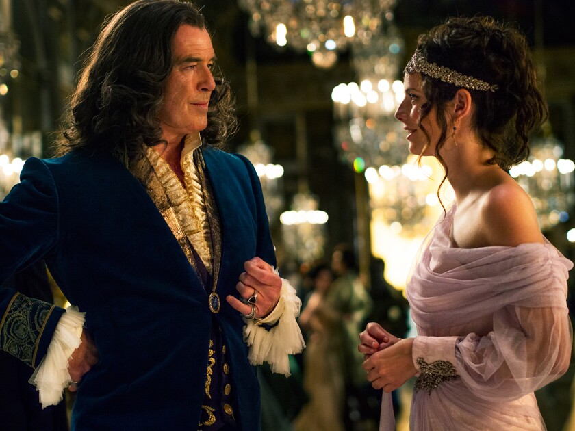 This image released by Gravitas shows Pierce Brosnan, left, and Kaya Scodelario in a scene from "The King's Daughter." (Gravitas via AP)