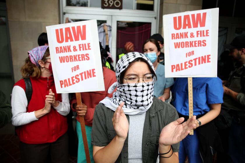 UAW workers stand in solidarity at UCLA during pro Palestine protest on Thursday, May 23, 2024 in Los Angeles.