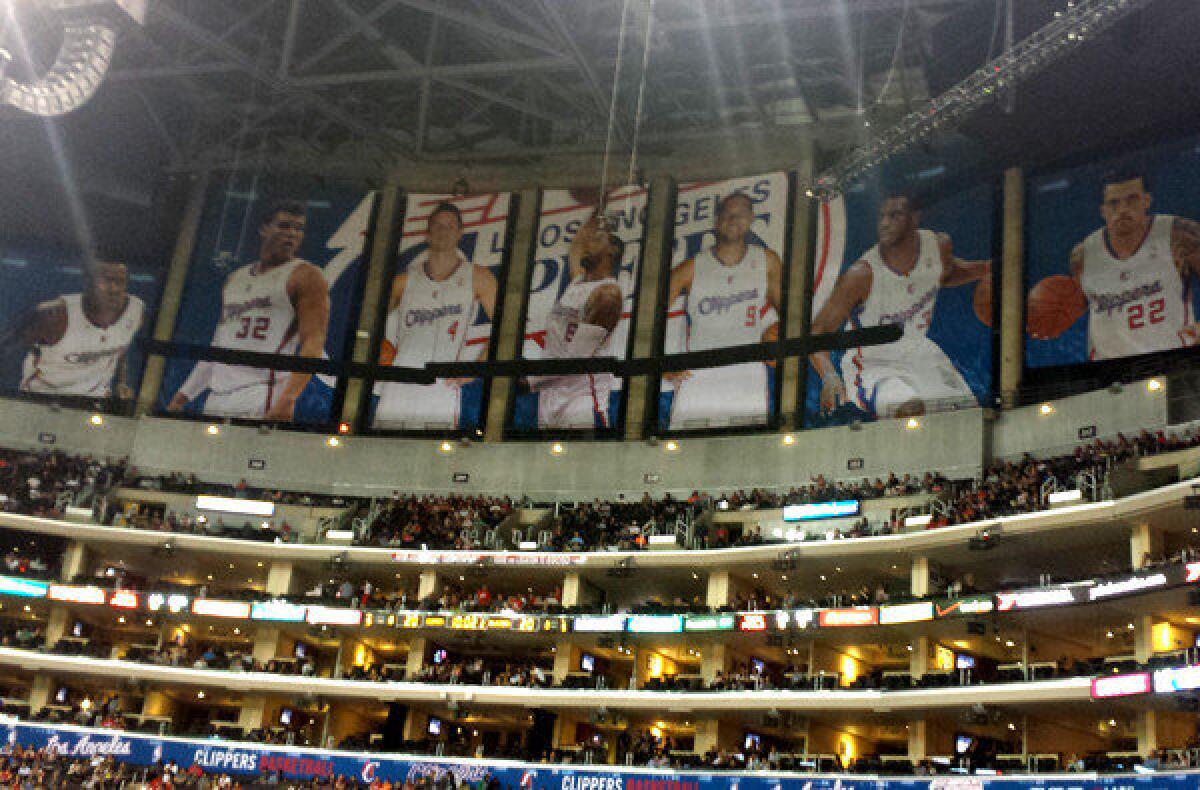 Banners of Clippers players block the view of the Lakers' championship banners at Staples Center.