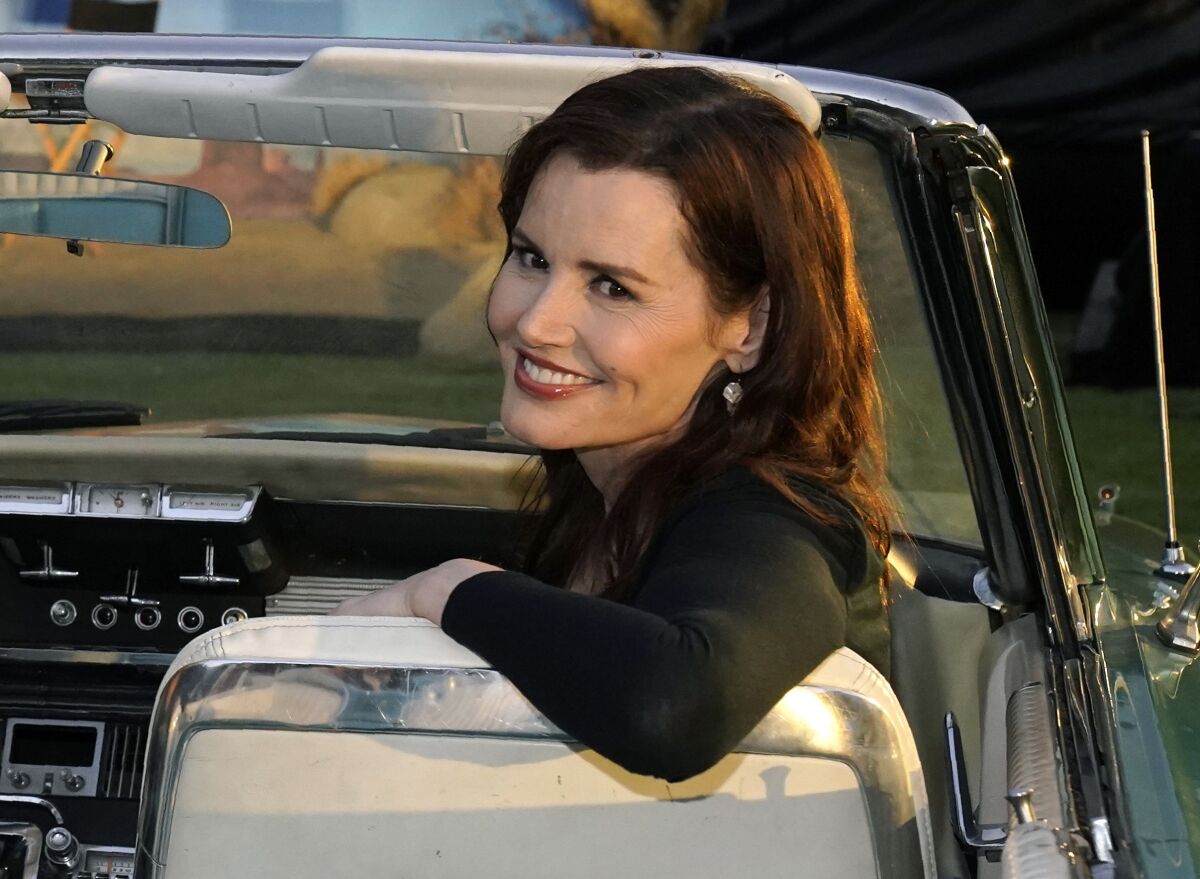 FILE - Geena Davis, star of "Thelma & Louise," poses in a 1966 Ford Thunderbird similar to the one featured in the film, at the 30th anniversary screening of the film in Los Angeles on June 18, 2021. Davis has a memoir coming out this fall, titled “Dying of Politeness.” HarperOne, an imprint of HarperCollins Publishers, announced Tuesday that the book will be published Oct. 11. (AP Photo/Chris Pizzello, File)