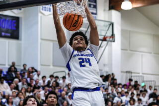 Davey Harris of Windward gets the dunk against Brentwood.