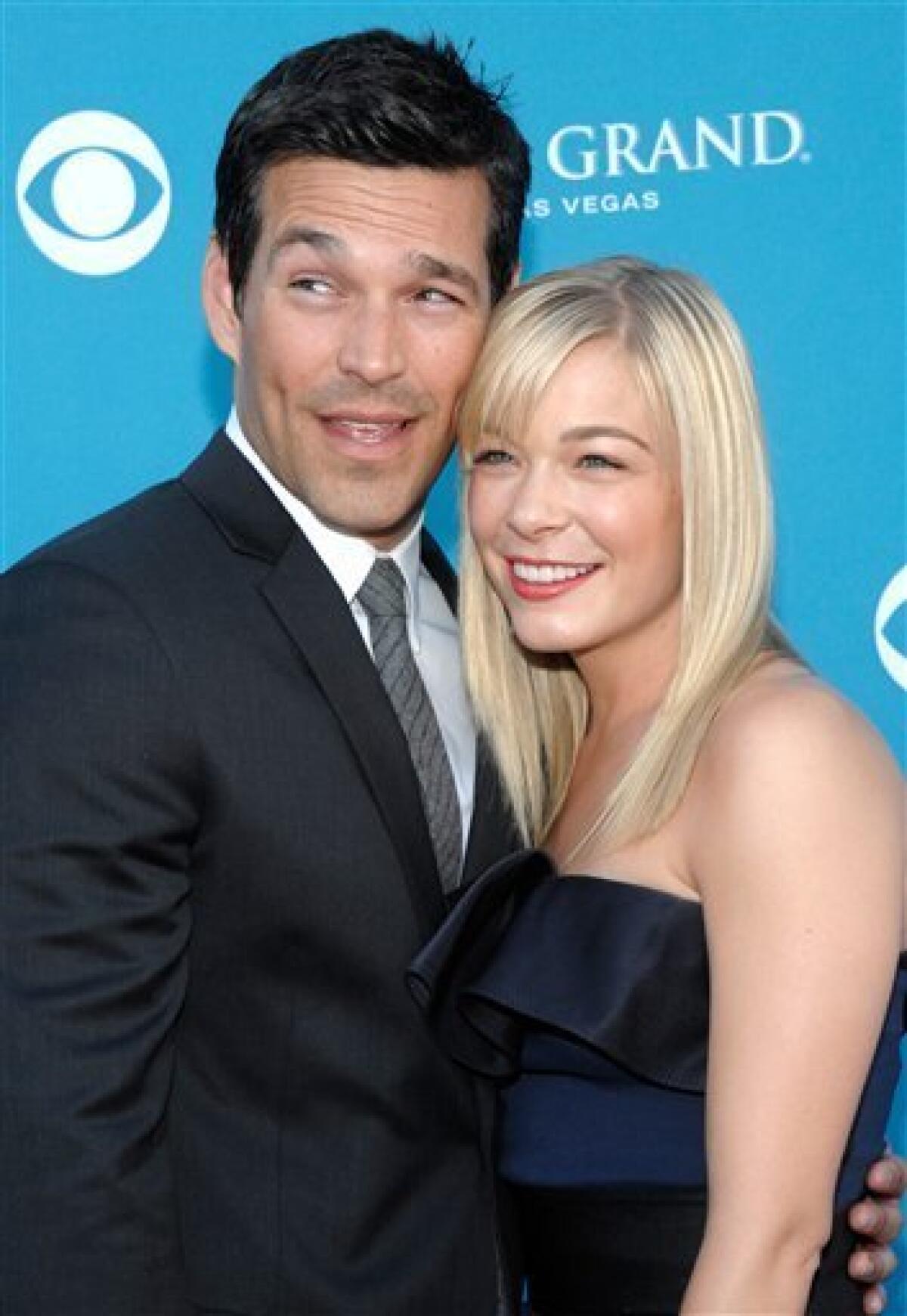 FILE - In this April 18, 2010 file photo, country singer LeAnn Rimes, right, and actor Eddie Cibrian arrive at the 45th Annual Academy of Country Music Awards in Las Vegas. (AP Photo/Dan Steinberg, file)