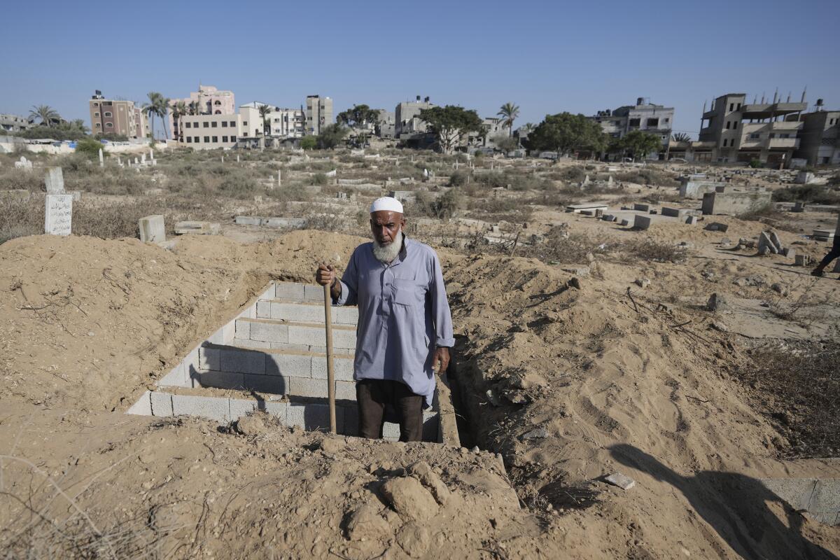 A man stands in a pit.