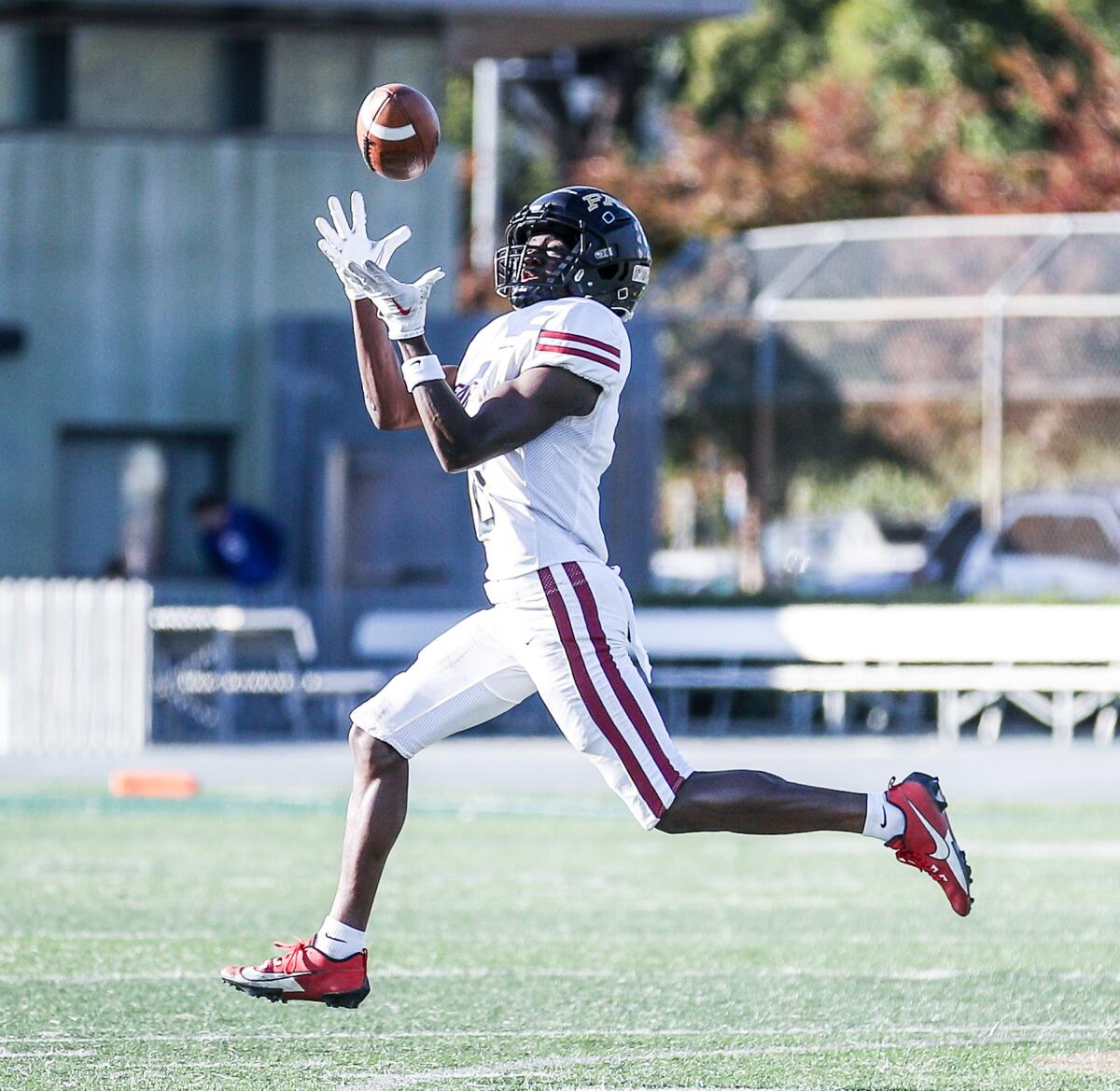 Sebastian Ikolo of Fairfax makes catch on his way to a 72-yard touchdown.