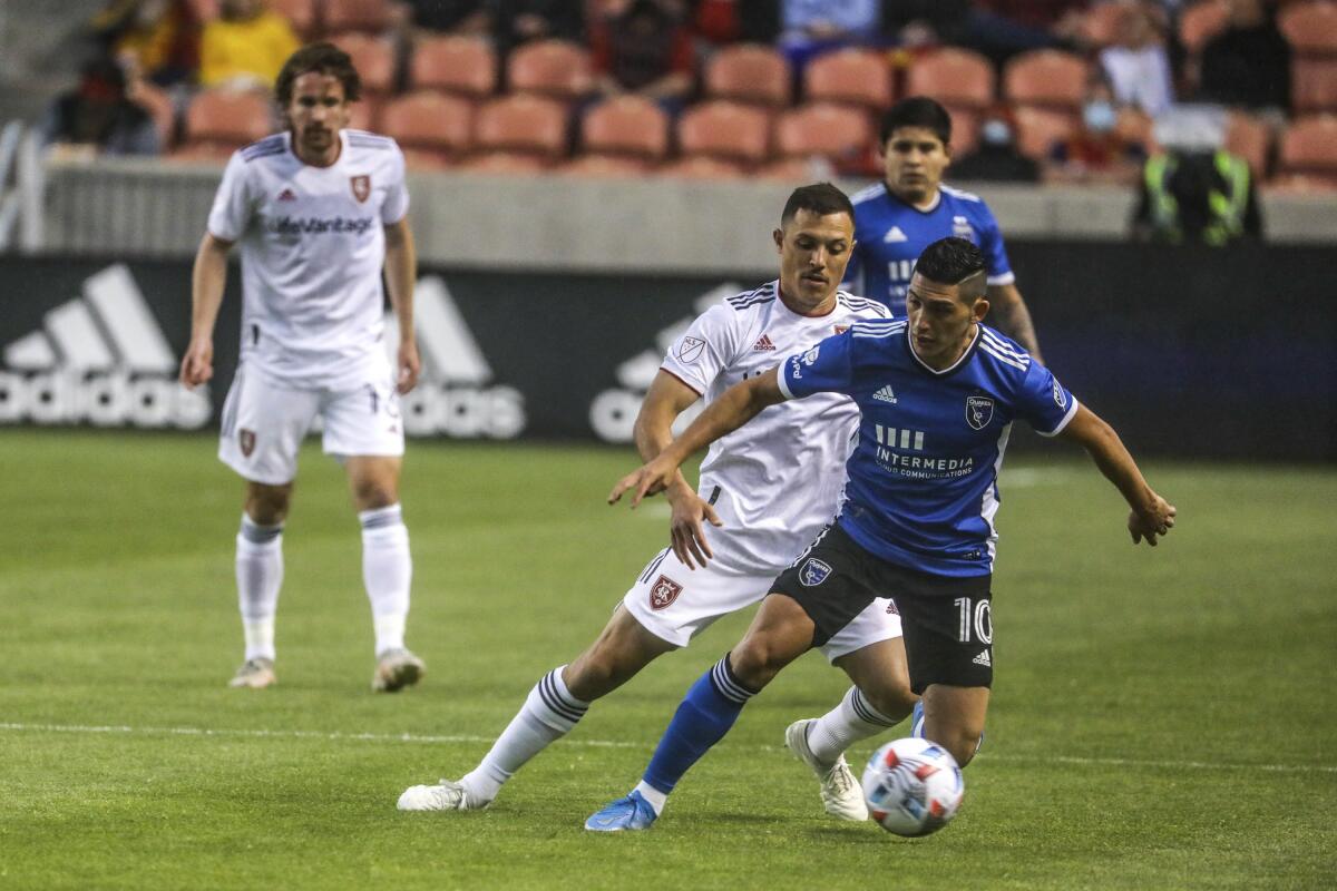 Real Salt Lake defender Donny Toia defends against San Jose Earthquake midfielder Cristian Espinoza (10) during an MLS soccer match Friday, May 7, 2021, in Sandy, Utah. (Annie Barker/The Deseret News via AP)
