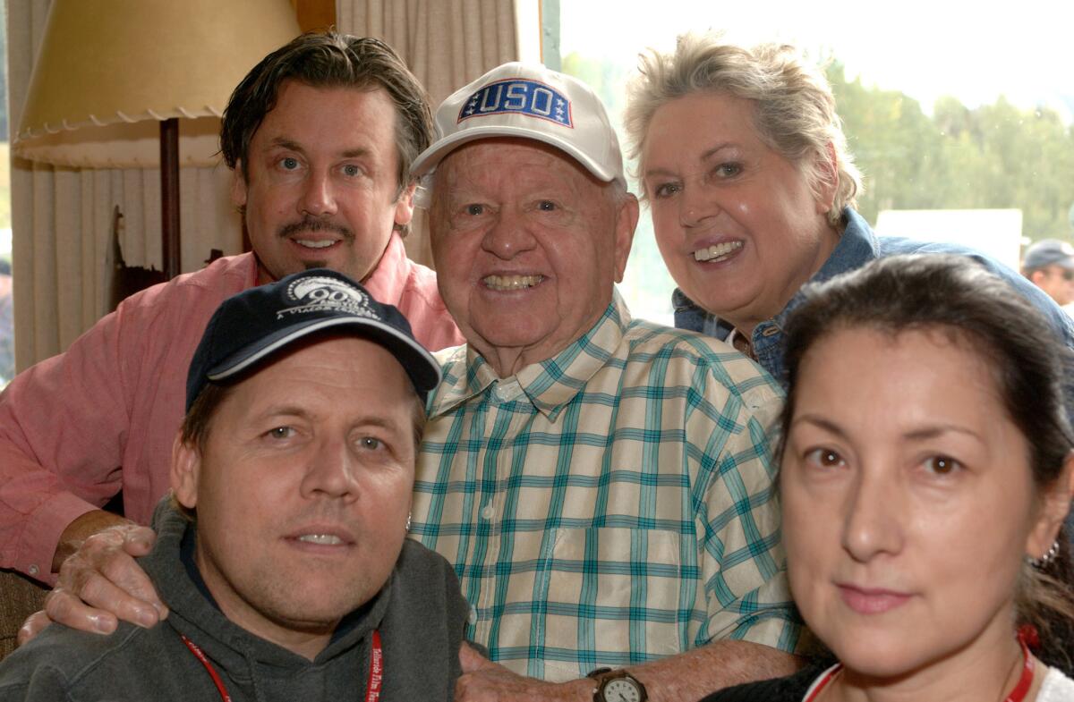 Mickey Rooney with his family, clockwise from upper left, son Chris, wife Jan, daughter-in-law Charlene, and son Mark.