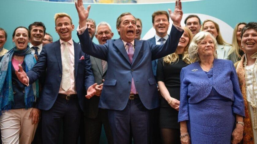 Brexit Party leader Nigel Farage speaks in front of his party's newly elected members of the European Parliament. The Brexit Party won 10 of Britain's 11 regions, gaining 28 seats and more than 30% of the pan-European vote that ended on May 26, 2019.