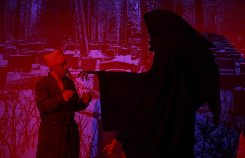 Ebenezer Scrooge, played by John Culver meets Ghost of Christmas Yet to Come.