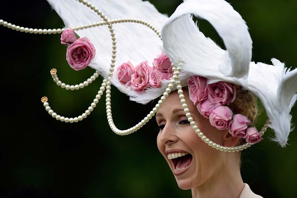 TV presenter and conservationist Anneka Tanaka-Svenska wears a hat designed by Louis Mariette during the first day of Royal Ascot. The five-day meeting is one of the highlights of the horse racing calendar. Top hats and tails remain compulsory in parts of the course while a daily procession of horse-drawn carriages brings the queen to the track.