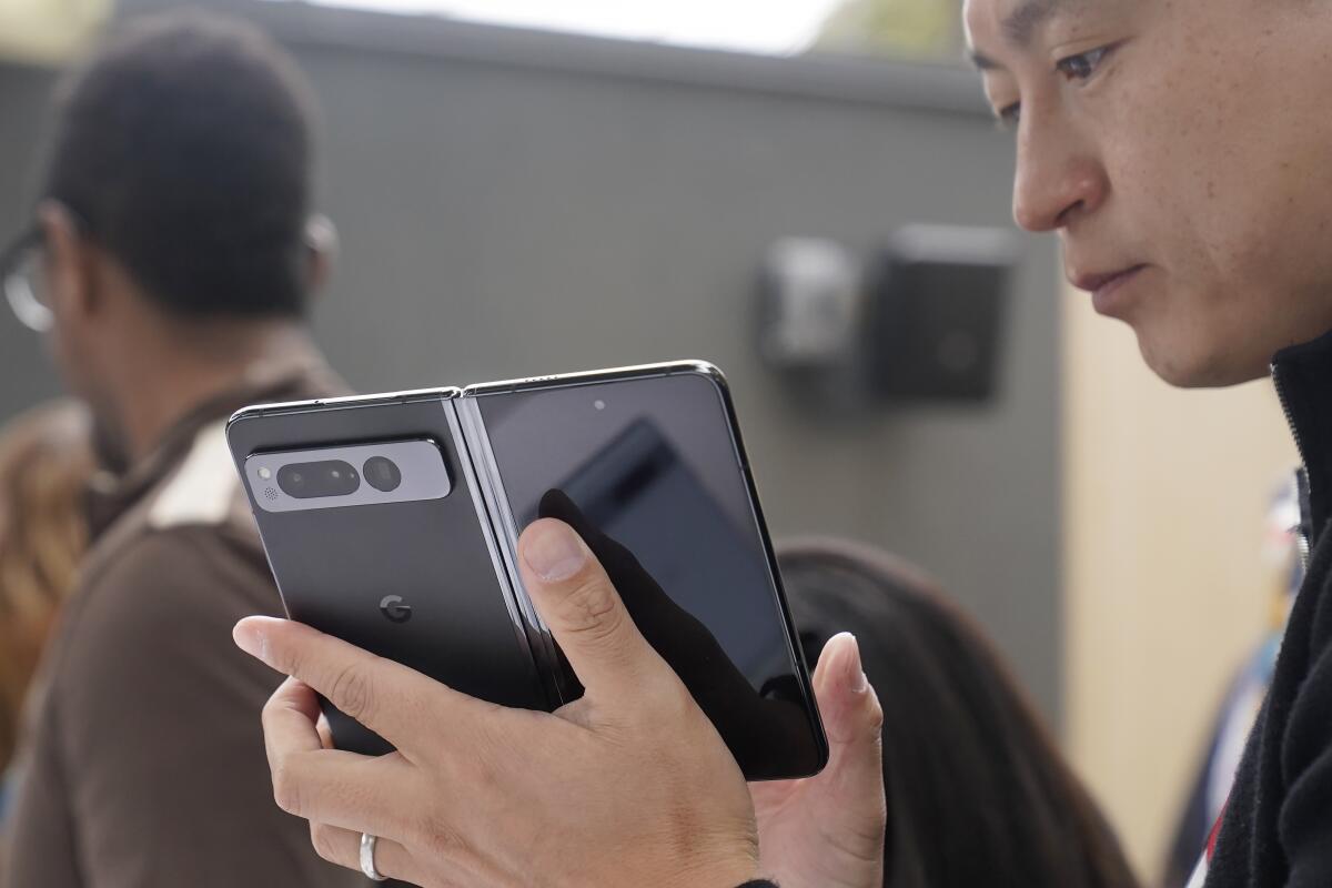 A person holds a foldable phone
