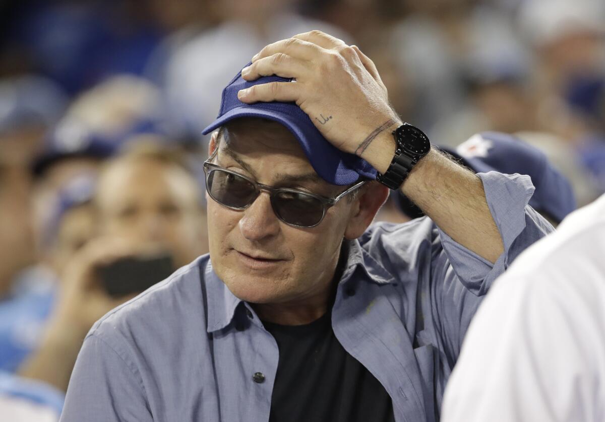 Actor Charlie Sheen reacts during the fifth inning of Game 4 of the National League Championship Series between the Cubs and the Dodgers on Wednesday.