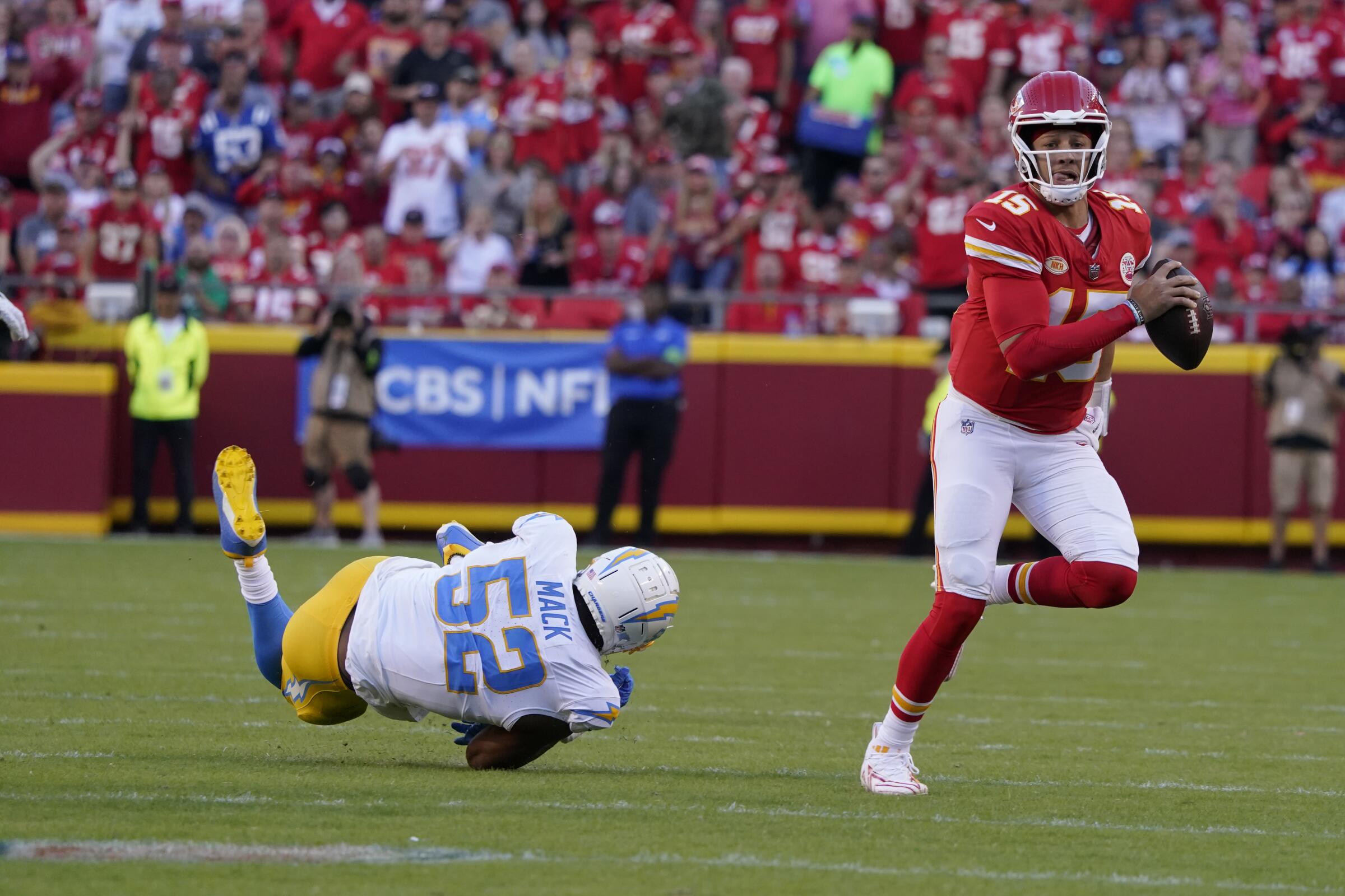 Chiefs quarterback Patrick Mahomes gets past Chargers linebacker Khalil Mack (52) in October.