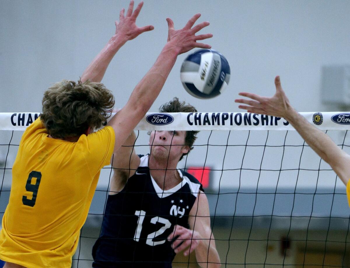 Newport Harbor High's Dayne Chalmers, pictured spiking the ball against Manhattan Beach Mira Costa on May 11, led the Sailors to a 25-17, 25-20, 25-16 win over Carlsbad Sage Creek in a CIF State Southern California Regional Division I opener Tuesday.