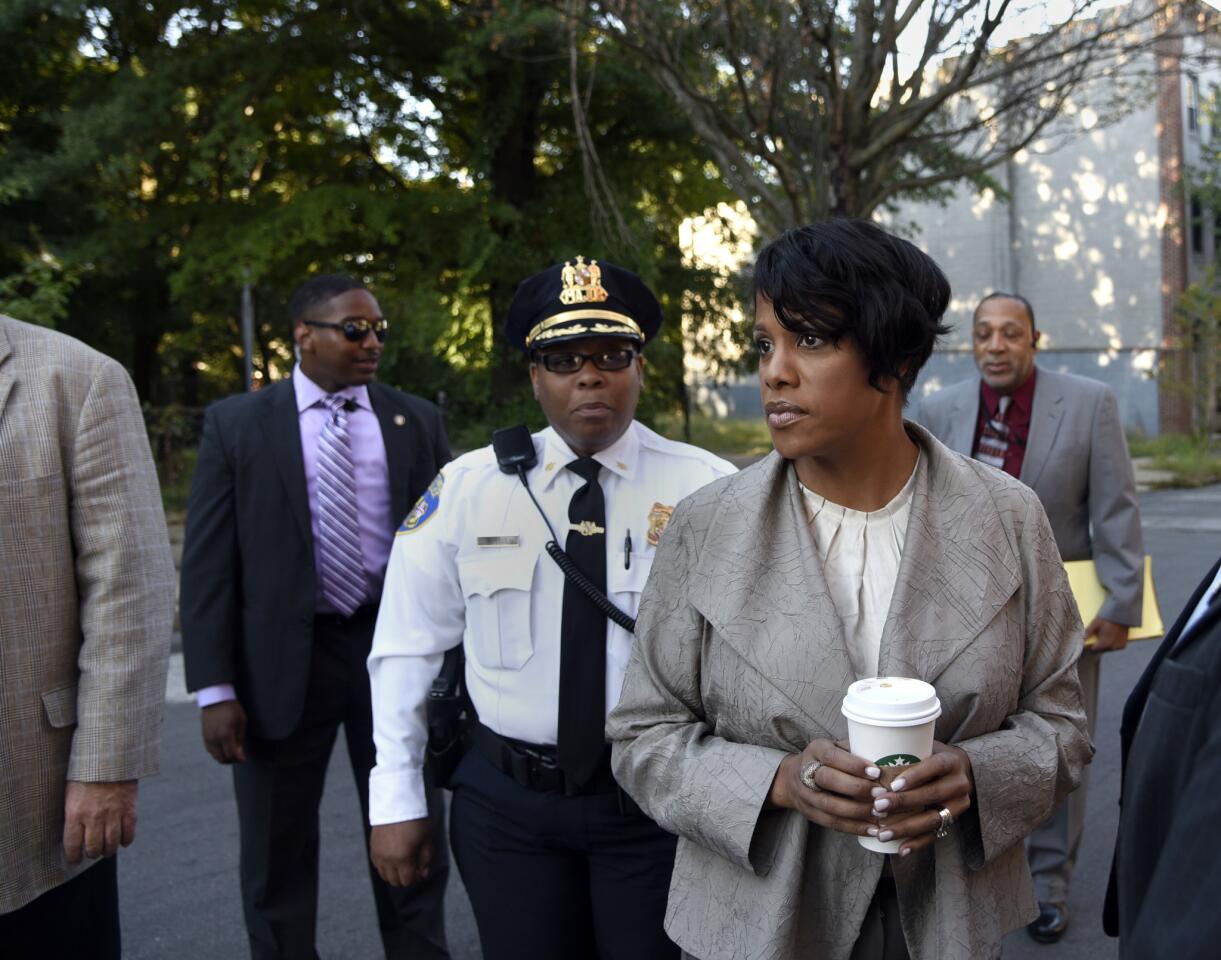 Mayor Stephanie Rawlings-Blake and other city officials take a "crime and grime" walk in the Lafayette Square neighborhood in West Baltimore.