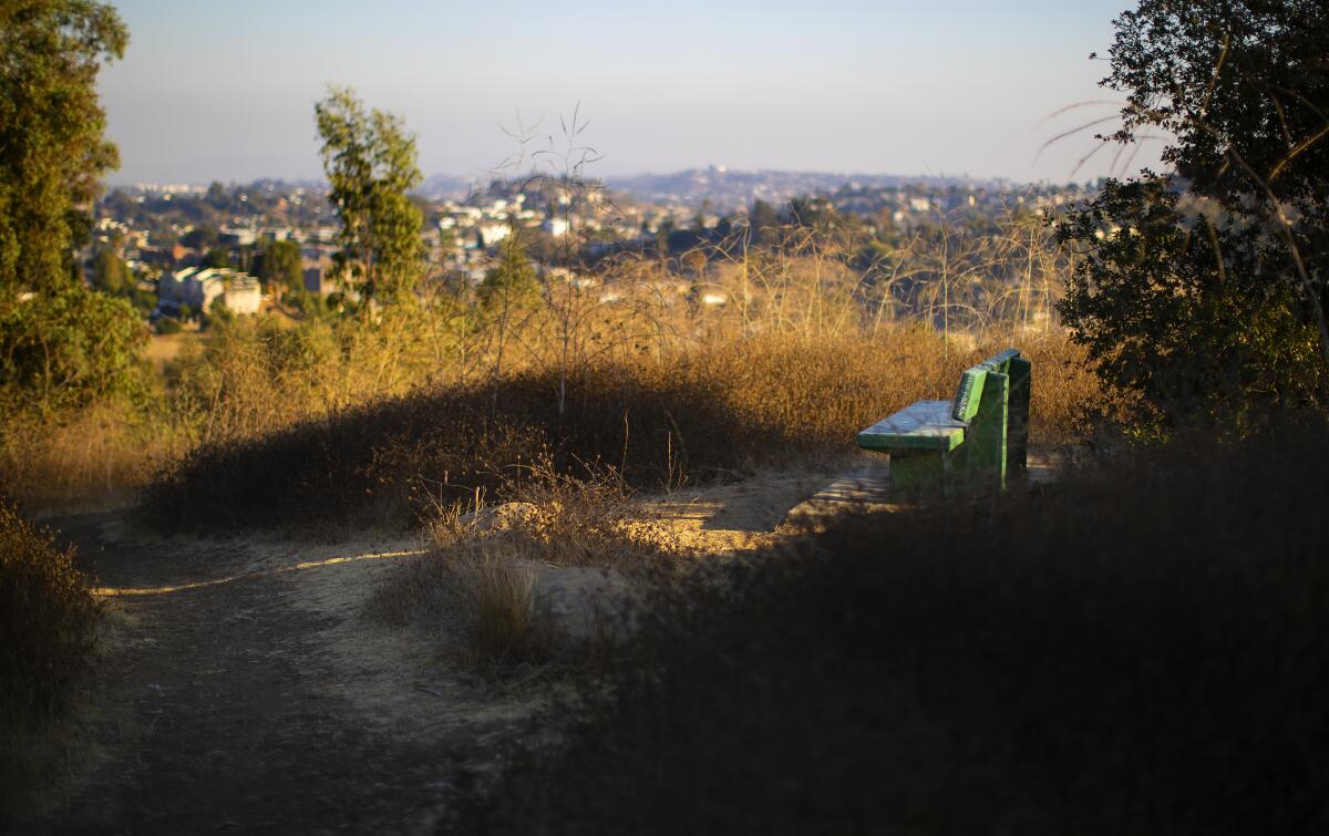 One of the green park benches overlooking Los Angeles on the way from Debs Park back to Rose Hill Park.